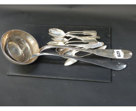 A large Antique Continental ladle with armorial crest to back of handle another ladle and two sets of six teaspoons