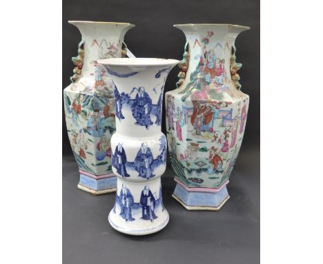 A pair of Chinese famille rose panel form vases with figural decoration 43cm hig together with a blue and white waisted beake