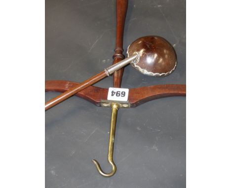 An unusual white metal mounted polished coconut and treen ladle together with a country house coat hanger