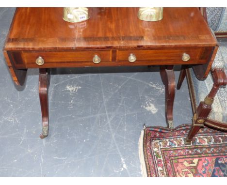 A Regency mahogany and rosewood banded sofa table