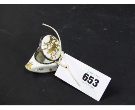 An unusual Antique Continental enamel patch box in the form of a tricorn hat with gilt figural and foliate decoration