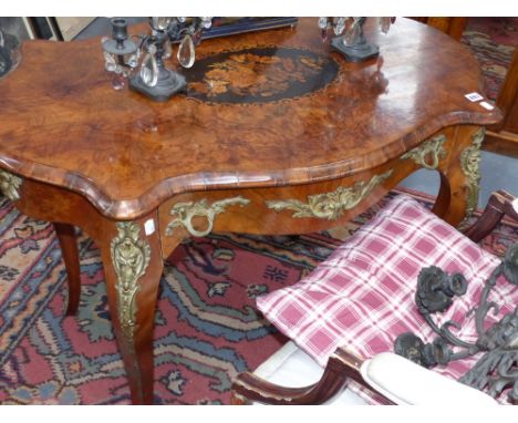 A 19th Century burr walnut inlaid and bronze mounted ladies writing table with frieze drawer. In the French style