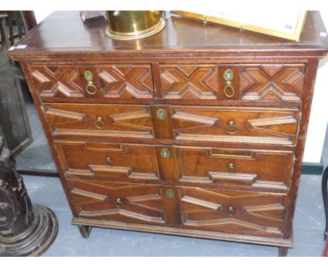 An early 18th.c.oak chest of drawers with geometric panel drawer fronts