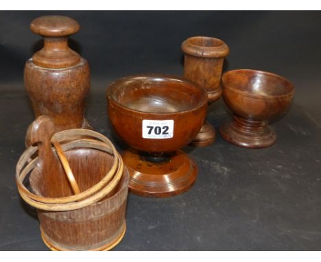 A group of five pieces of treen three cups, a piggin and a covered grinder