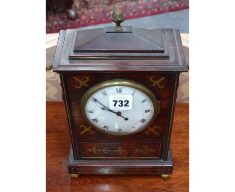 A small Regency mahogany and brass inlaid bracket clock