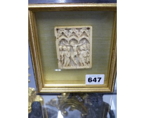 An early carved ivory Continental panel depicting the Crucifixion.