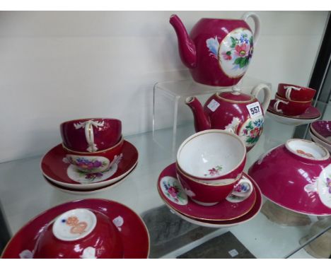 An Antique Russian porcelain part tea service, claret red with floral panels
 
CONDITION REPORT:-
11 CUPS AND SAUCERS 2 TEAPO