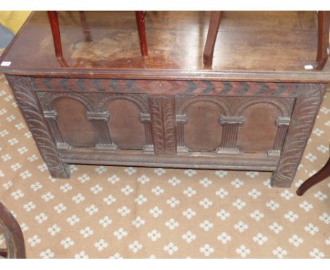 An 18th.c.oak coffer with architectural panel front