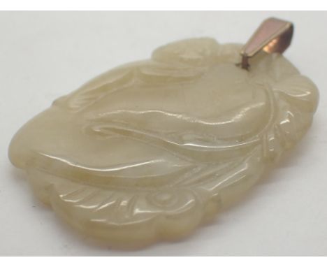 Carved jade talisman featuring a monkey