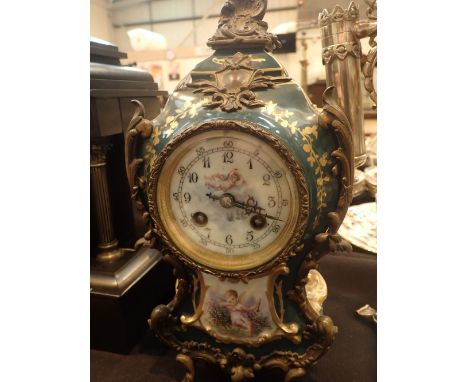 Ceramic mid 19thC continental clock with hand painted cherub design gilt and ornate decoration ceramic dial bevelled glass H: