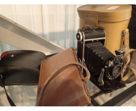 Vintage Bellows camera and two pairs of binoculars 