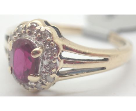 9ct gold oval ruby and diamond cluster ring size K / L