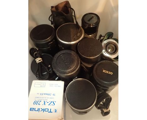 Box of mixed camera lenses and a camera body