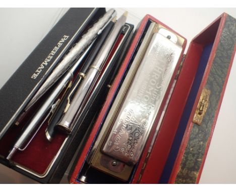 Mixed pens including Parker white metal fountain pen and a harmonica