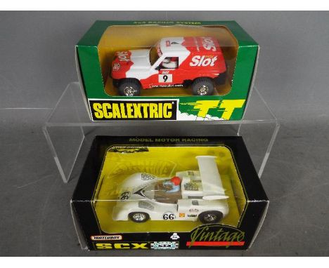 Scalextric / Matchbox SCX - a Scalextric 4 x 4 Racing System Patrol 'Mas Slot' Ref 6517 214/600 and a Matchbox SCX Vintage Ch