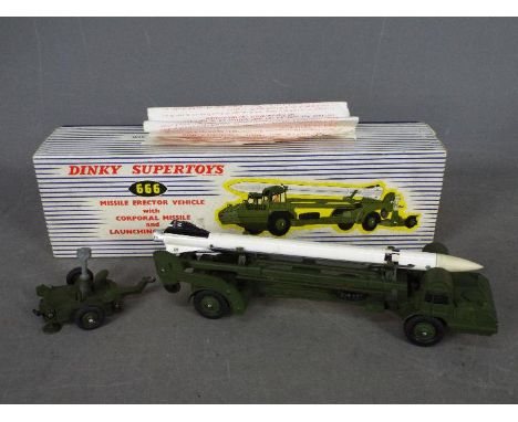 Dinky - A boxed # 666 Missile Erector Vehicle with Corporal Missile and LAunching Platform. The vehicle is in Very Good condi