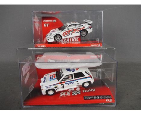 Scalextric  - a Scalextric Tecnitoys GT Porsche 911 GT3 Cup #6281 and an SCX Rally Mitsubishi Lancer Evo VIII 'Basols' #63610