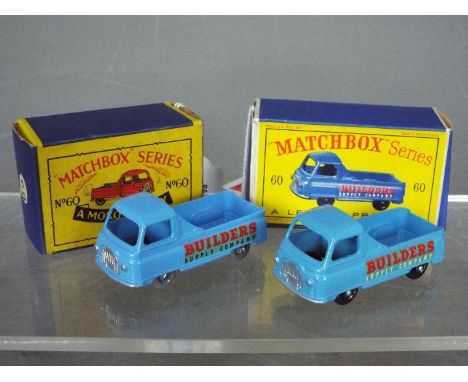 Matchbox, Lesney - Two boxed versions of Matchbox  #60 Morris J2 Pick-Up.  with light blue body and rear window; one has blac