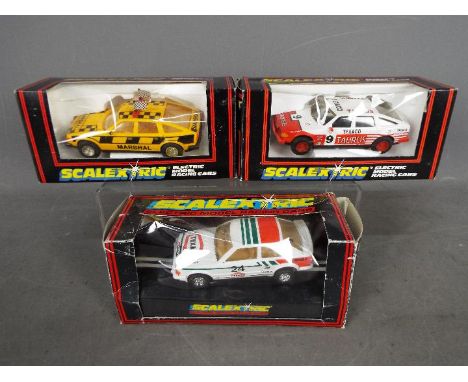 Scalextric by Hornby - three Scalextric Electric Model Racing Cars comprising C.340 Track Marshals Car, C.384 Taurus Rover 35