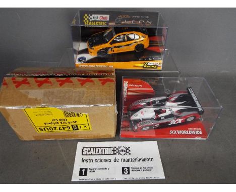 Scalextric - a Scalextric Tecnitoys 2005 Limited Edition Car  #6169, appears mint in perspex display case and an SCX Worldwid