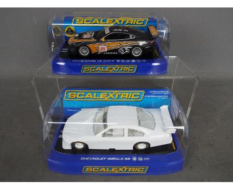 Scalextric - two 1:32 scale models comprising Chevrolet Impala SS Undecorated #2957 and Lotus Exige V6 Cup R #C3509, both mod