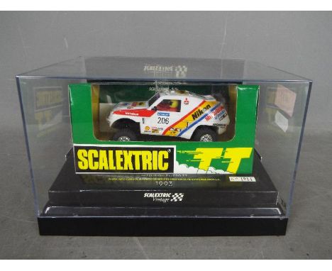 Scalextric - a Scalextric Vintage 4 x 4 Racing System Mitsubishi Pajero TT 1993, No 1014, appears mint in perspex display cas