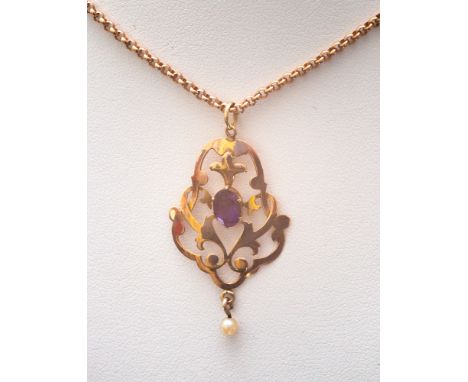 Edwardian rose gold amethyst and seed pearl pendant on a belcher link chain, pendant stamped 9ct, chain hallmarked.  Gross we