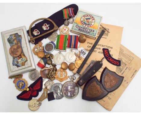 Collection of military items to include a pair of World War II medals and miniatures, army knife, pocket watch, buttons and b