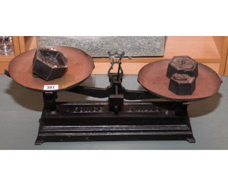 Set of old balance scales with couple of weights 
