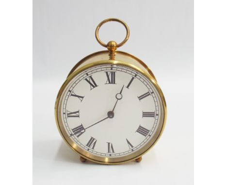 Circular French brass carriage style clock with key, white dial and Roman numerals - measures 14 cm with handle up