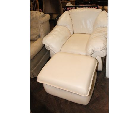 Modern easy chair in cream leather with matching pouffe 