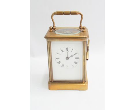 French brass carriage clock with key - measures 19 cm high with handle up