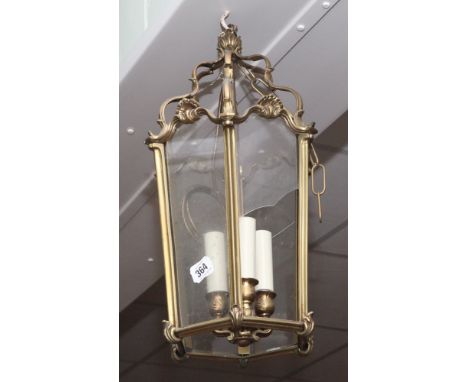 Brass hanging hall lantern, glass panels as found 