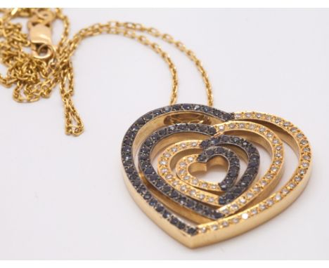 Sapphire and diamond heart shaped pendant set in 18ct yellow gold on 18ct yellow fine gold chain.  Chain hallmarked.  Gross w