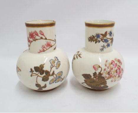 Pair of Royal Worcester vases painted with spring flowers on an ivory ground - measures 17 cm tall  One has a fairly sizable 
