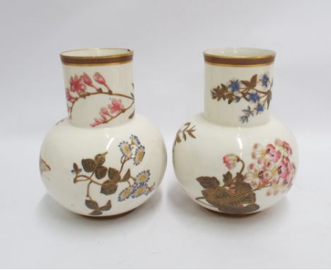 Pair of Royal Worcester vases painted with spring flowers on an ivory ground - measures 17 cm tall  One has a fairly sizable 