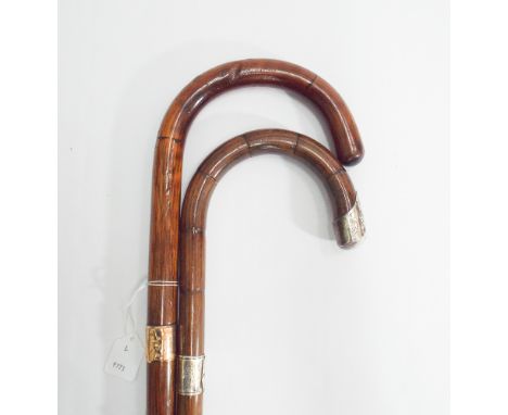 Gold mounted cane walking stick and a similar silver mounted stick - 3' long each