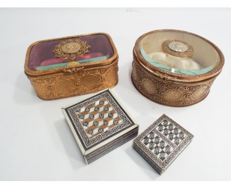 Two French gilt metal mounted glass lidded trinket jars with quilted silk interior and two Moorish inlaid boxes with lids inl