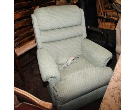 Manual reclining easy chair in pale green covering 