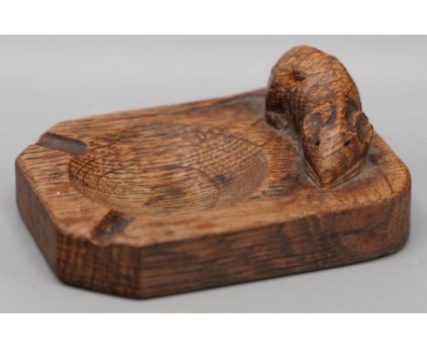 Robert Mouseman Thompson of Kilburn - an oak rectangular ash tray, carved with signature mouse, W10cm D7.5cmShipping £28.00 p