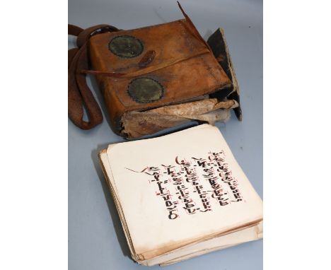 19th century West African-style Arabic manuscript, in calf leather case with Morocco ties, leaves unbound with upper board fu