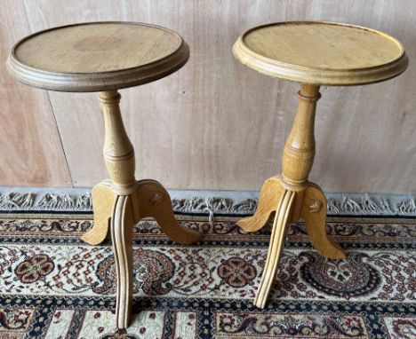 Geoff Unicornman Gell, Coxwold Cabinet Makers - a pair of oak tripod wine tables, circular tops on turned columns and three c