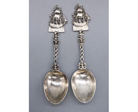 Pair of foreign silver spoons with galleon finials on twist and cast handles, import marks 925, possibly Berthold Hermann Mul