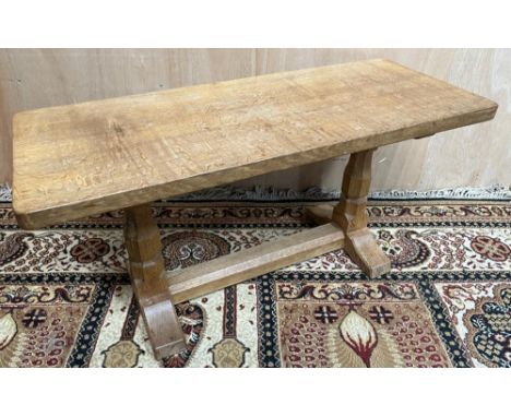 Robert Mouseman Thompson of Kilburn - an oak rectangular coffee table, adzed top on octagonal baluster and block supports wit