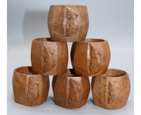 Robert Mouseman Thompson of Kilburn - a set of six octagonal oak napkin rings, each carved with signature mouse, H5cm (6)Ship