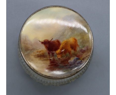 Silver mounted glass dressing table jar, the circular cover inset with a Royal Worcester plaque painted with Highland cattle 