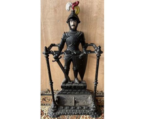 Cast metal stick stand in the form of a knight on castellated base and script `Cap A Pier' Victorian registration mark to the