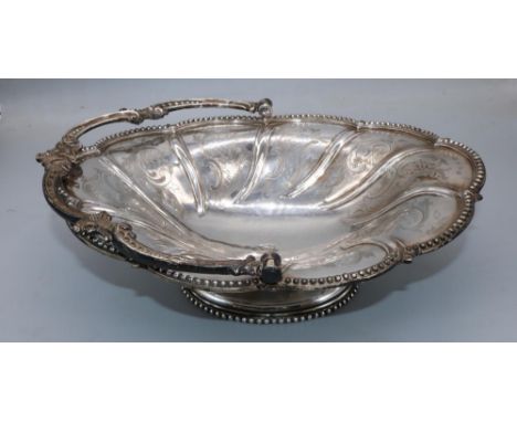Victorian silver oval swing handled basket, engraved with C scrolls with beaded border and similar handle, on oval base, by H
