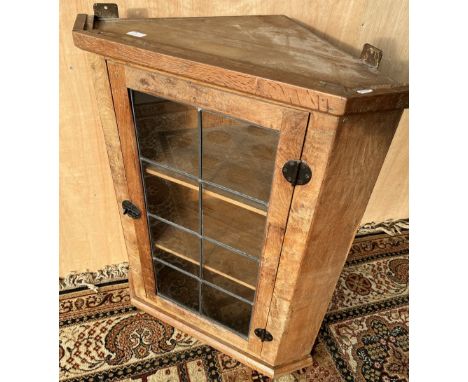 Sid Pollard Thirsk - an oak corner cupboard, with eight panel lead glazed door, iron hinges and handle, W71cm D43cm H90cmUnev