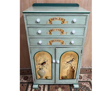 Vintage sage green painted kitchen cabinet, three drawers labelled Spices, Recipes and Herbs above two doors painted with bir